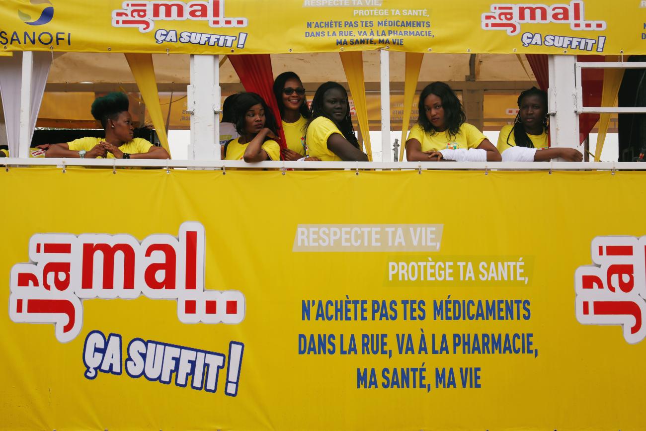 Girls stand in a truck during a campaign to raise awareness about illegal and false drugs in Abobo, a suburb of Abidjan, Ivory Coast, on October 11, 2018. 