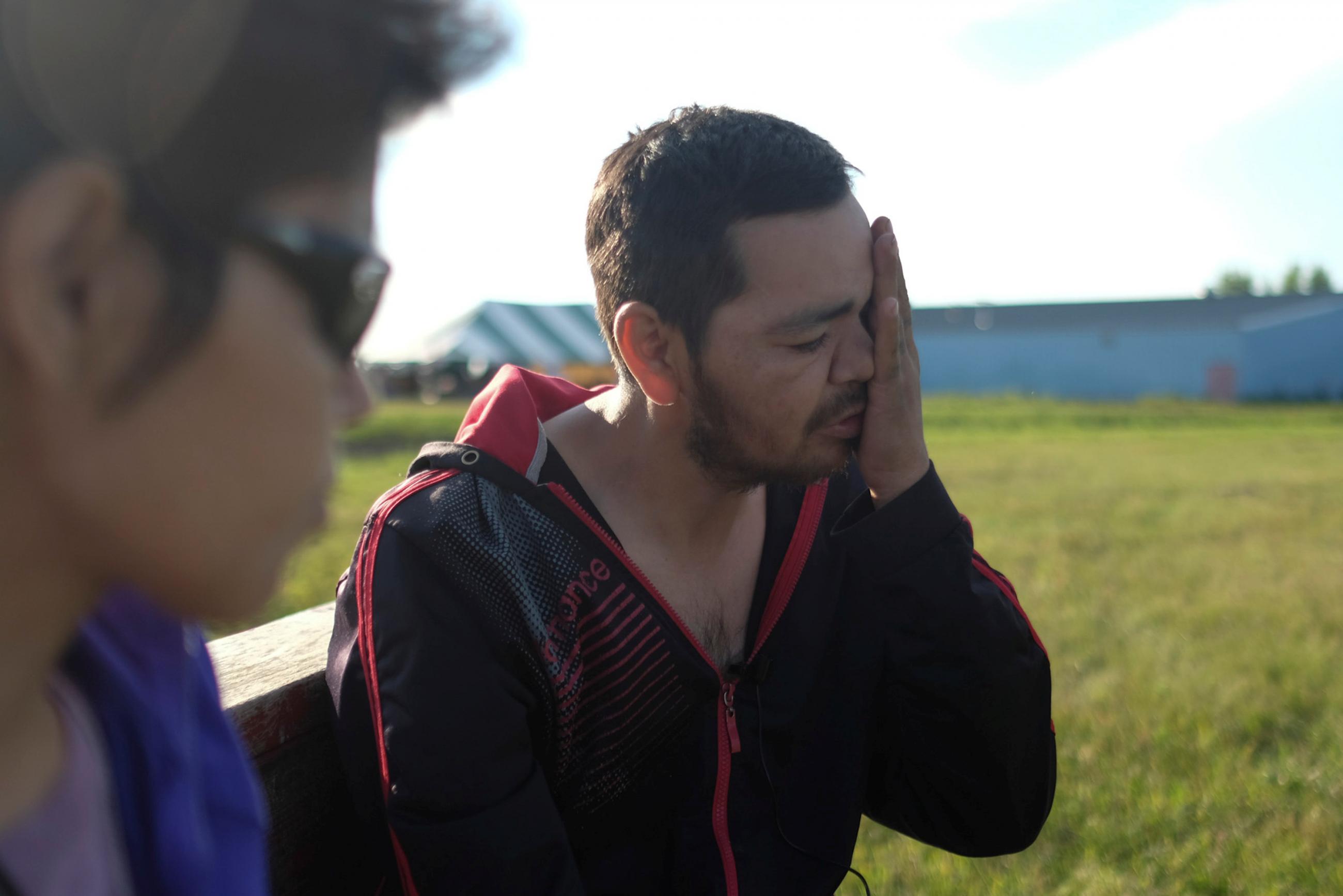 Lawrence Quezance of the Cote First Nation fights back tears as he talks about his recent HIV diagnosis at a First Nations Indigenous Warriors and American Indian Movement event near Kamsack, Saskatchewan, Canada, on August 5, 2017.
