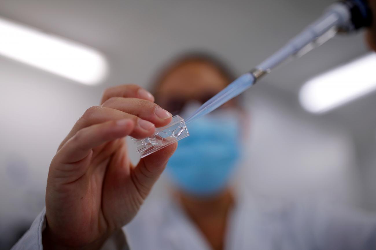 A researcher manipulates proteins in a lab—part of a project to develop a COVID nasal spray vaccine that could protect against the virus—at the University of Tours, France, on September 15, 2021.