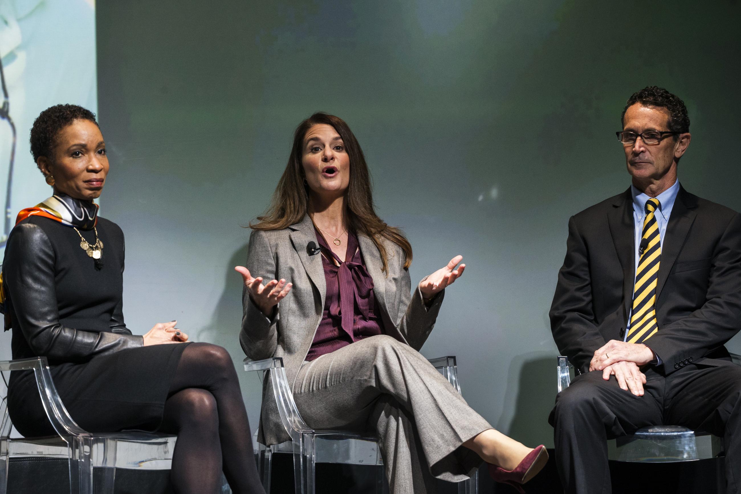 Melinda Gates speaks with Helene Gayle, president of CARE, and Bruce Wilkinson, CEO of the Catholic Medical Mission Board during the unveiling of the "No Ceilings" study in New York, on March 9, 2015.