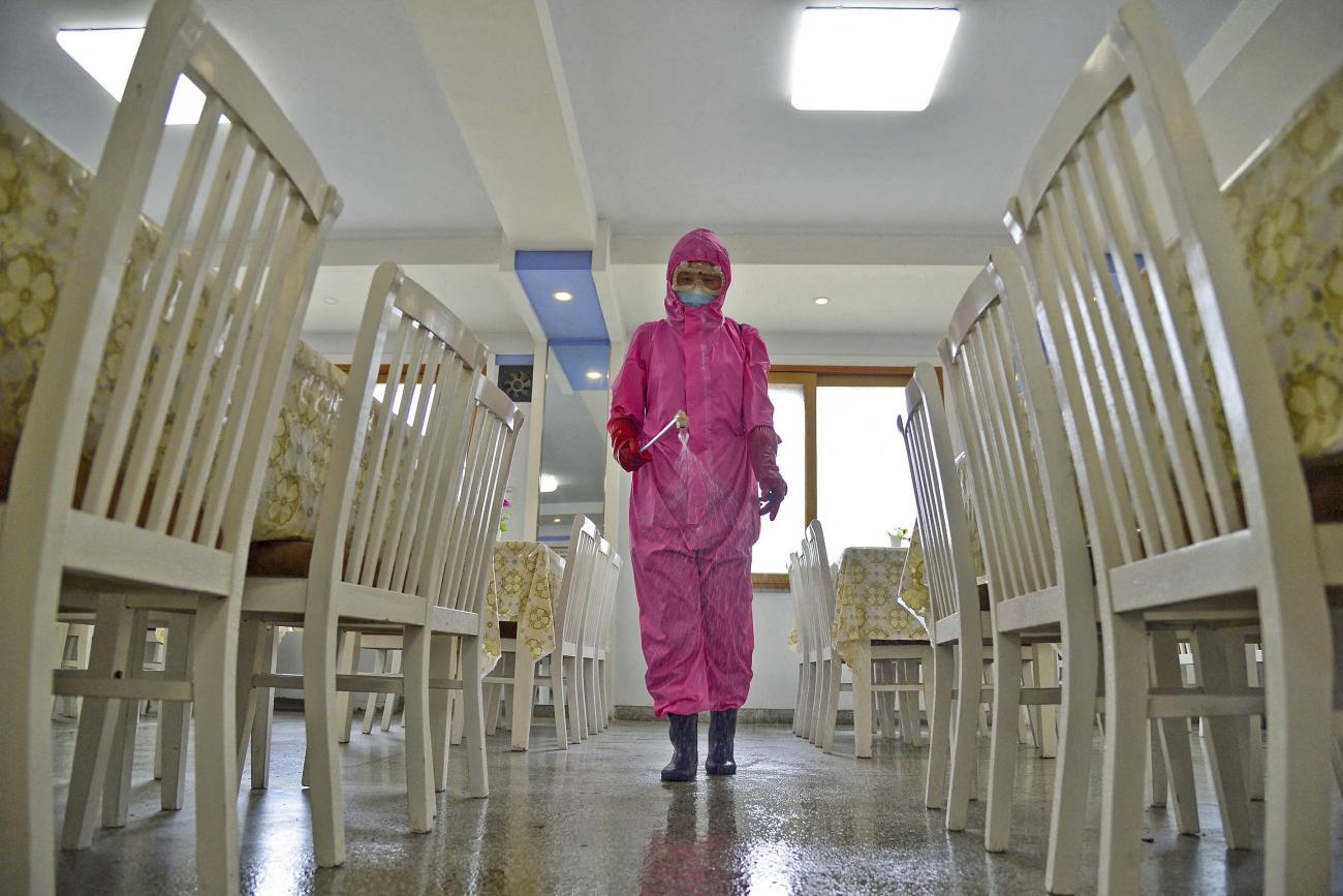 A worker disinfects a dining room at a sanitary supplies factory, amid growing fears over the spread of COVID-19, in Pyongyang, North Korea, on May 16, 2022.