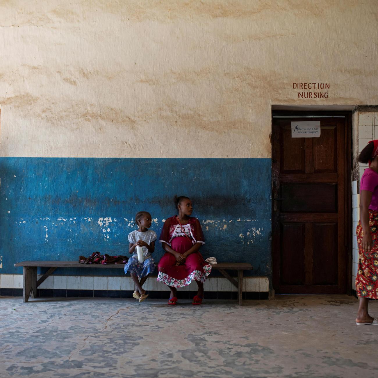 Women and their children wait for a consultation with Dr. Fabien Kongolo in the waiting area of the Yakusu General Hospital, Tshopo, Democratic Republic of Congo, October 5, 2022.