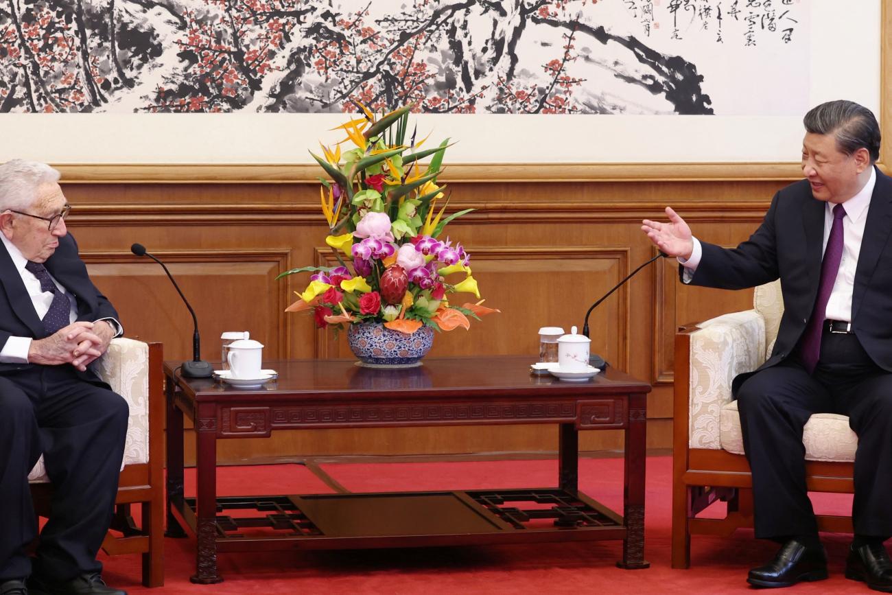 Chinese President Xi Jinping and Henry Kissinger, former U.S. secretary of state, attend a meeting.