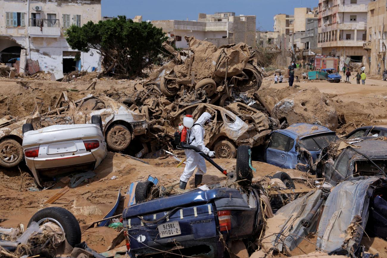 A sanitation worker disinfects rubble, amid rising concerns of spread of infectious diseases following fatal floods in Derna, Libya, September 17, 2023. 