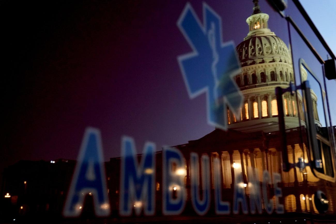 The U.S. Capitol dome is reflected on an ambulance at sunset in Washington, U.S. November 10, 2020.