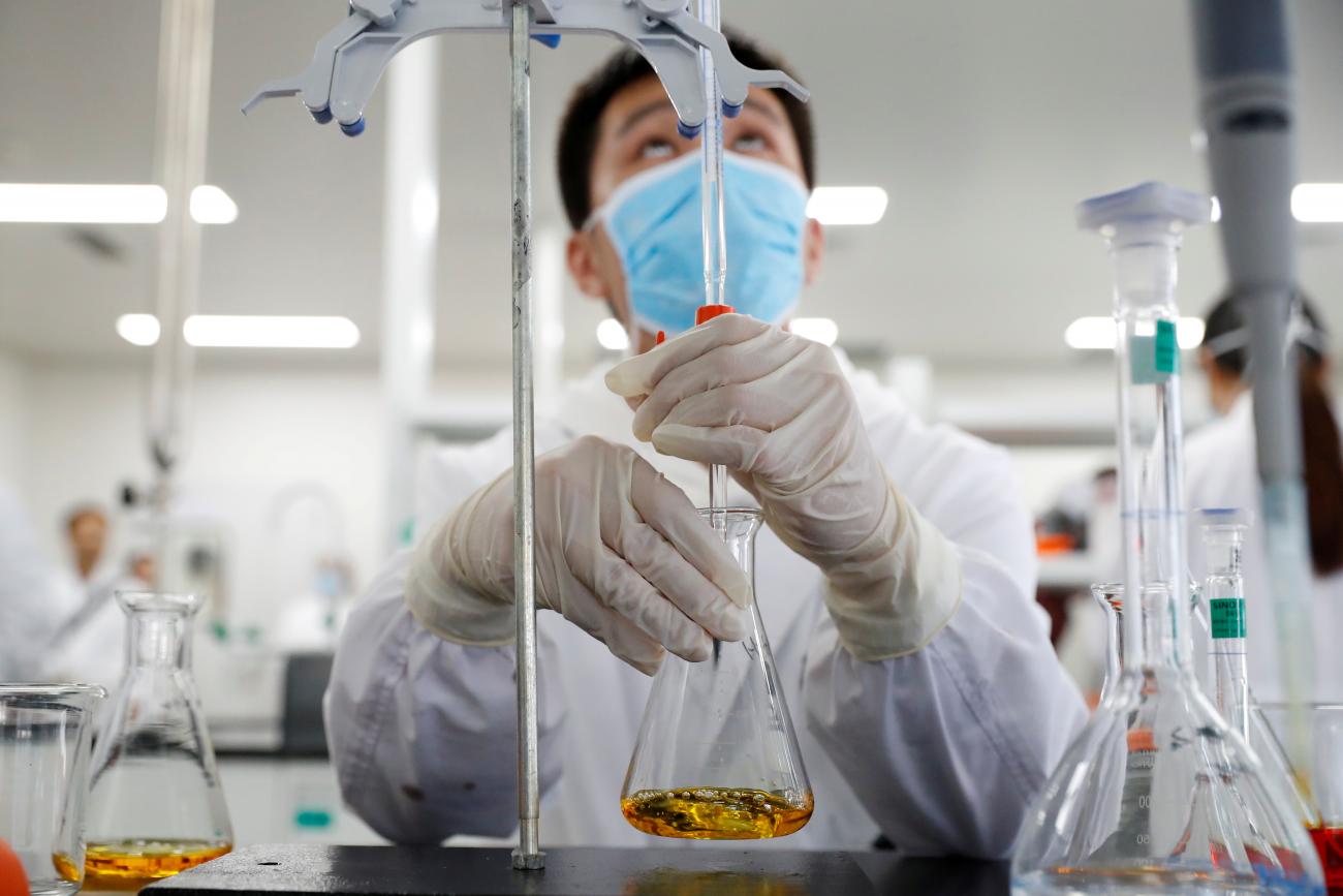 A man works in a laboratory of Chinese vaccine maker Sinovac Biotech, developing an experimental coronavirus disease (COVID-19) vaccine, during a government-organized media tour in Beijing, China, September 24, 2020.