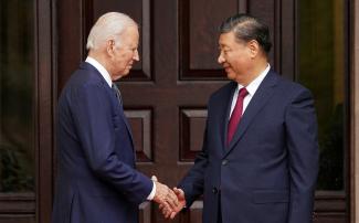 U.S. President Joe Biden shakes hands with Chinese President Xi Jinping.